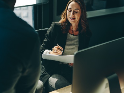 Conveyancer reviewing legal documents